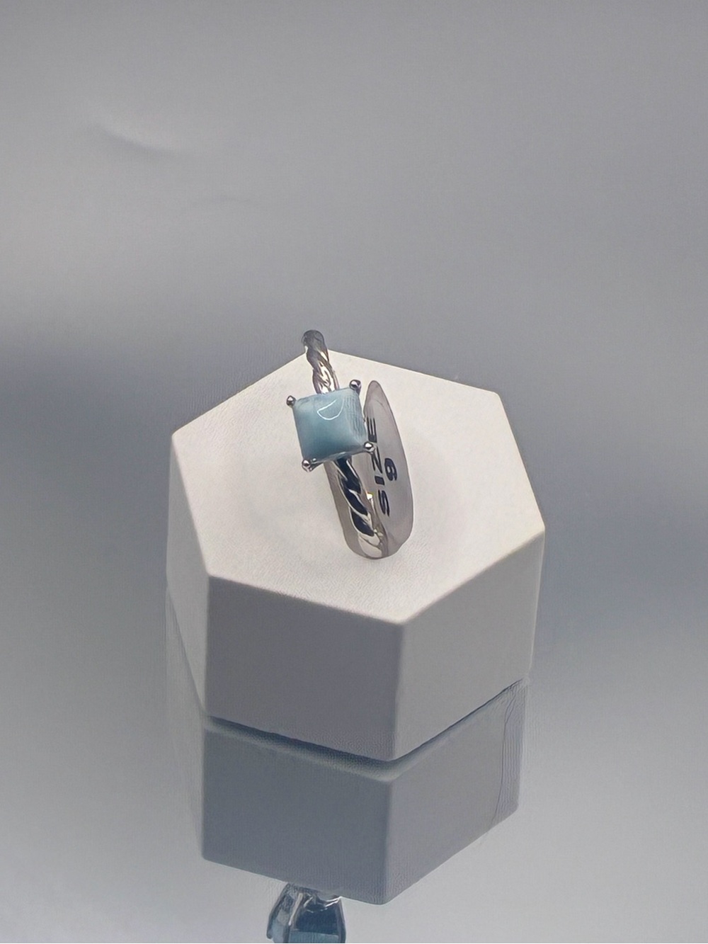 Sterling Silver Ring with Light Blue Square Gemstone and Twisted Band